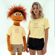 A person wearing a yellow t-shirt with the text 