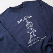 A navy blue sweatshirt with a white graphic design depicting a witch on a broomstick and the text 