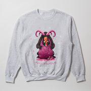 A gray sweatshirt with a graphic design depicting a cartoon image of a man with horns, wearing a purple outfit, and surrounded by snowflakes.