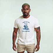 A man wearing a white t-shirt with a graphic of a panda and the text 