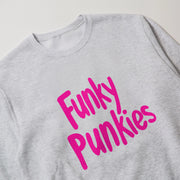 A grey sweatshirt with pink text that says 