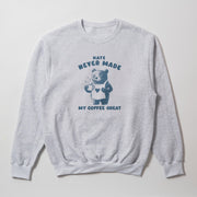 A gray sweatshirt with a graphic design featuring a bear holding a cup of coffee and the text 