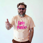 A man with a beard wearing a t-shirt with the text 