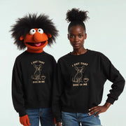 Two people wearing black sweatshirts with a cartoon dog and the text 