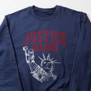 A navy blue sweatshirt with a graphic design featuring a drawing of the Statue of Liberty and the text 