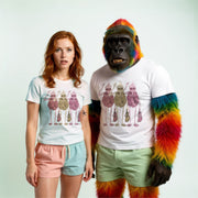 A woman with red hair wearing a white t-shirt with a colorful graphic and a man with a colorful, furry costume standing next to each other.