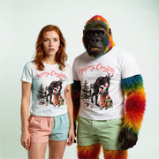 A woman wearing a white t-shirt with a Christmas-themed graphic and a man wearing a white t-shirt with a colorful, rainbow-colored monkey graphic.