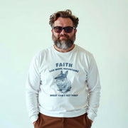 A man wearing a white long-sleeved shirt with a graphic of a cat and the text 
