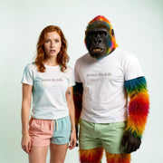 A woman with red hair wearing a white t-shirt with the text 